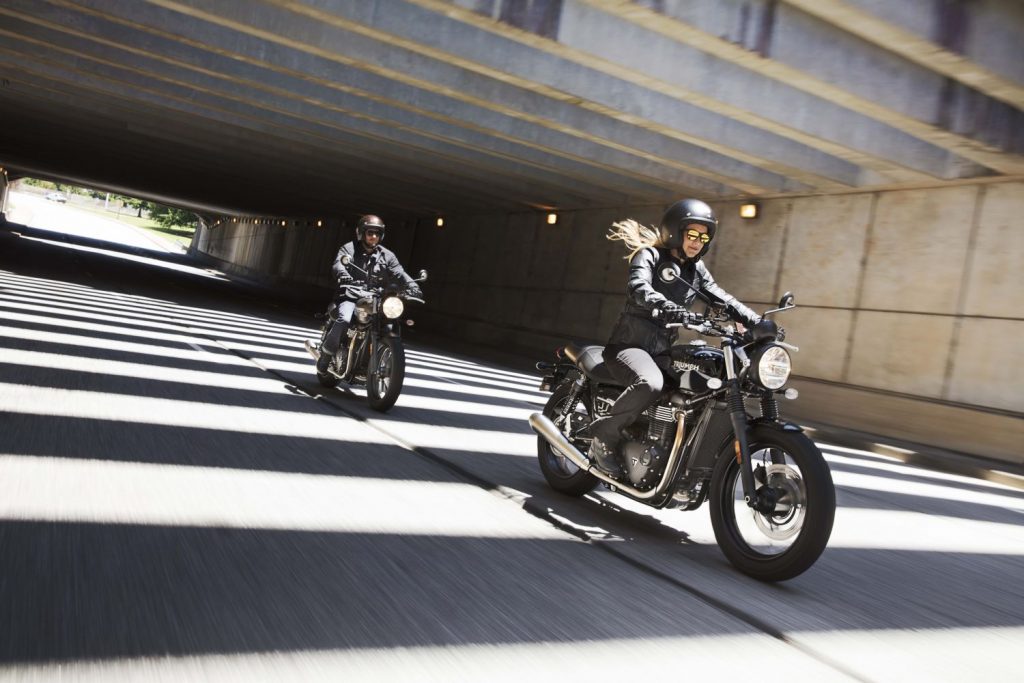 Two people riding Triumph Street Twins