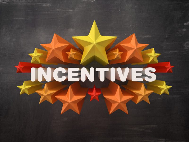 Colourful stars with the word 'incentives' on a chalkboard background