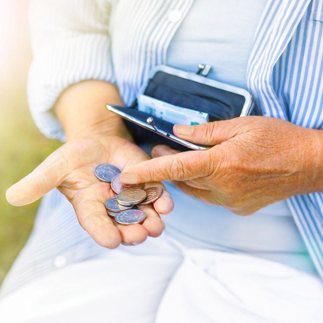 Woman counting coins