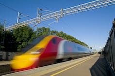 A train passing through a station at speed.