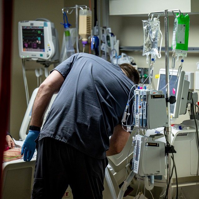 A nurse checks on a Covid-19 patient in the intensive care unit at Saint Claire Regional Medical Center in Morehead, Kentucky, U.S., on Wednesday, Dec. 1, 2021. Kentucky