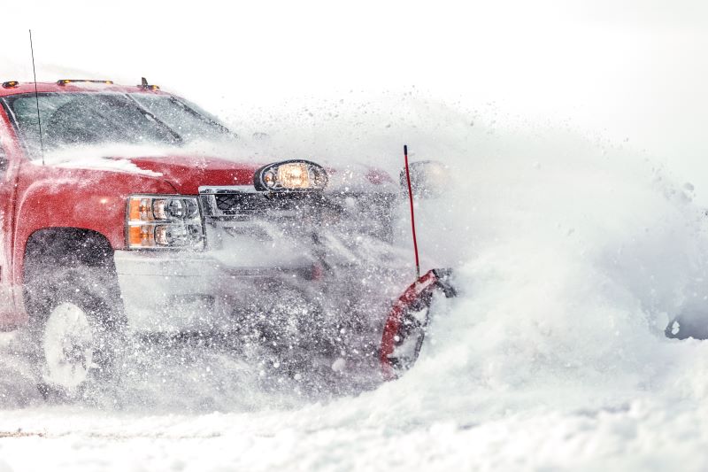 snow plough hitting a snow drift