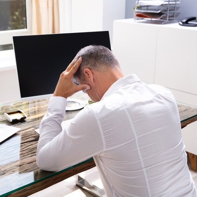 Worried businessman at computer