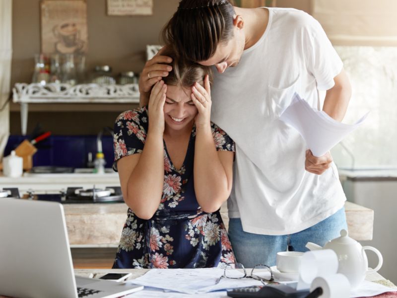 couple managing budget in the kitchen