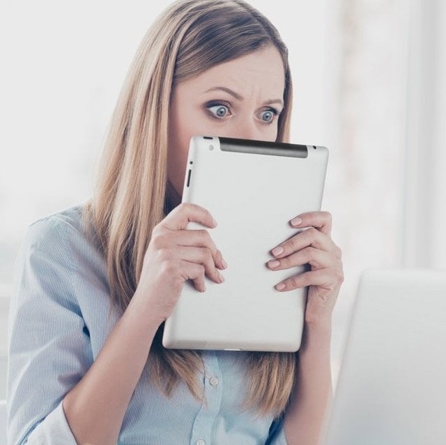 A scared looking woman (Image: deagreez/Adobe Stock)