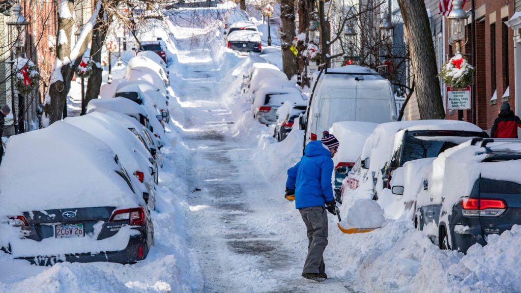 How a Cardboard Box Can Be a Quick and Easy Go-To for Clearing Snow Off Your Car