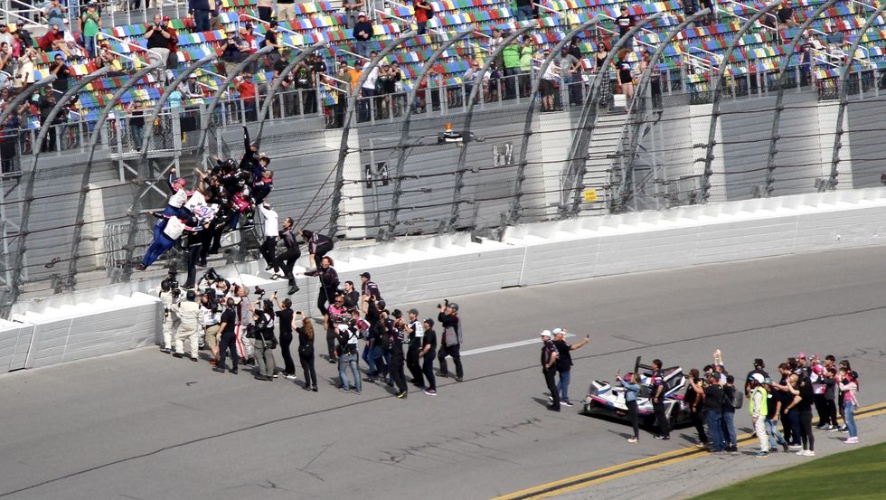 the no 60 acura team celebrates their victory