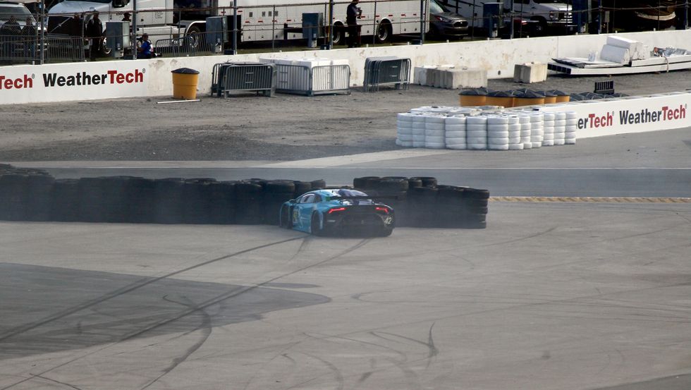 a lamborghini huracan gtd car in a tire barrier