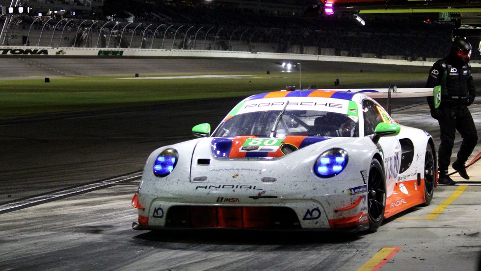 a porsche 911 gtd car in the pit lane