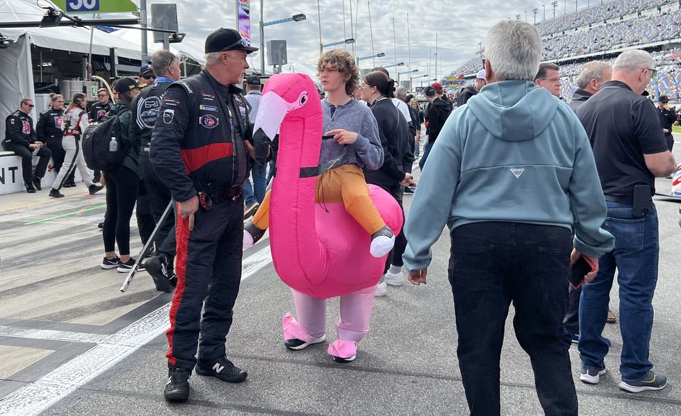 someone in an inflatable flamingo costume at the 24 hours of daytona