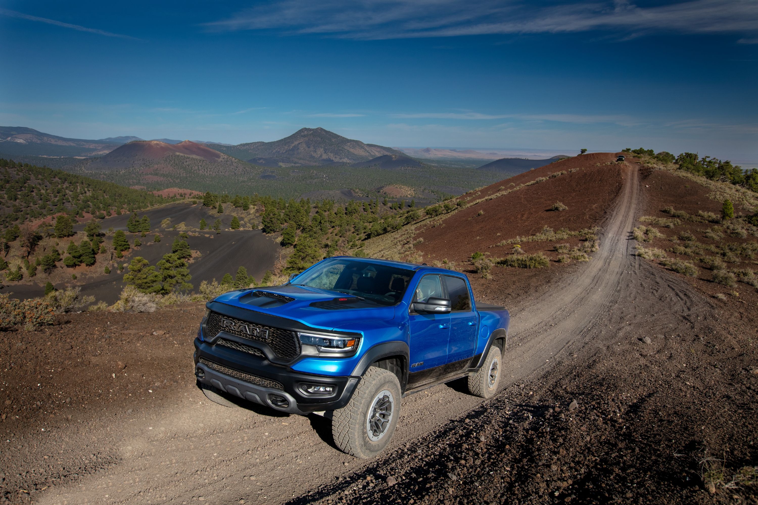 2023 ram 1500 trx off roading over a hill