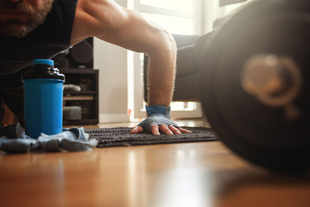  Man training his arms doing push-ups.