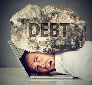 stockfresh_7501032_man-squeezed-between-laptop-and-rock-student-loan-debt-concept_sizeS-300x279