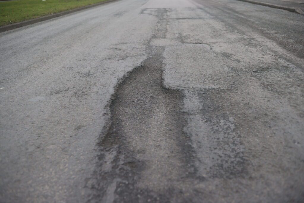 Taxi and pothole damage