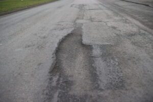 Taxi and pothole damage