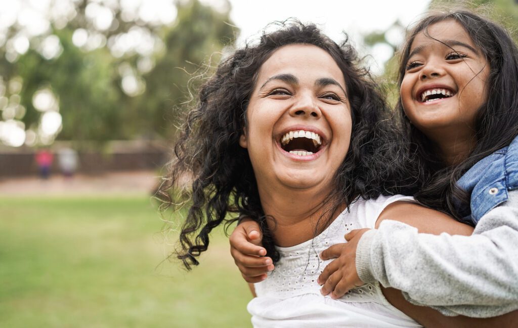 Stay-at-home mom with daughter in park