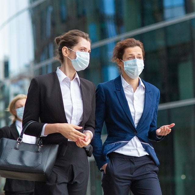 Business people in masks