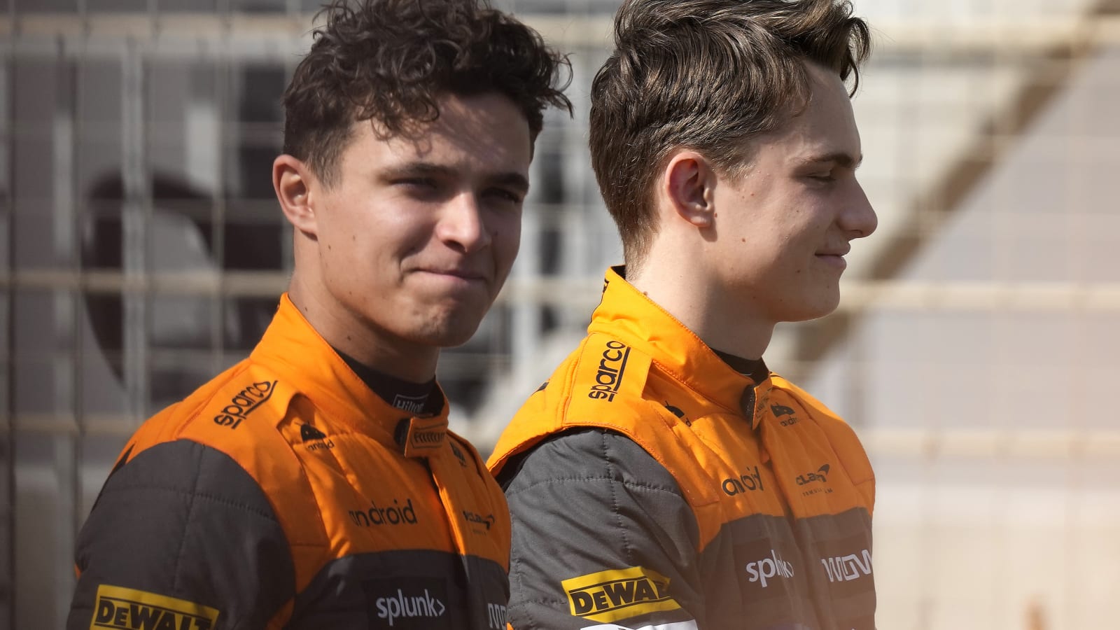 Mclaren driver Lando Norris of Britain and Mclaren driver Oscar Piastri of Australia wait for the start of the Formula One pre season test at the Bahrain International Circuit in Sakhir, Bahrain, Thursday, Feb. 23, 2023.(AP Photo/Frank Augstein)