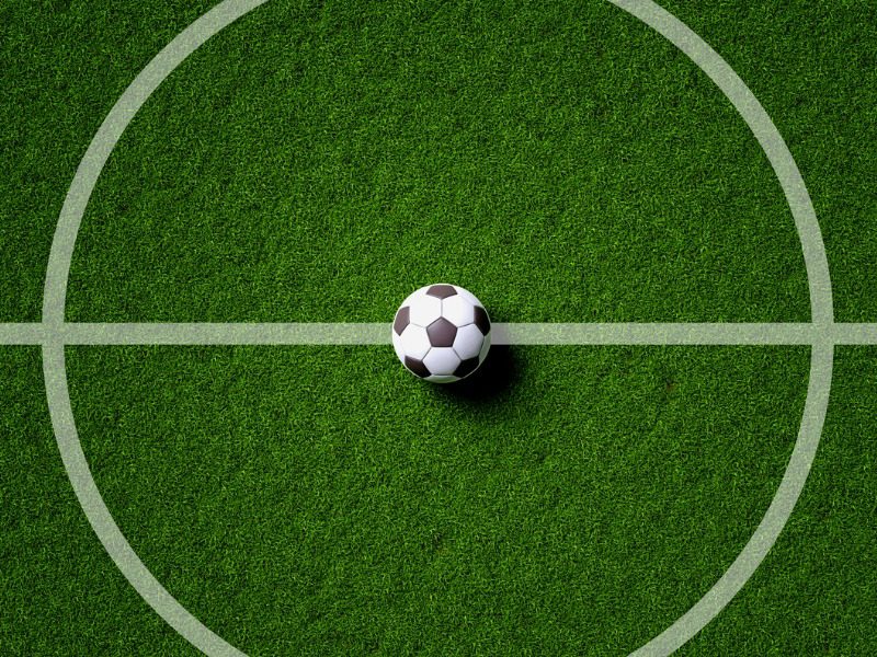 Soccer field center and ball in top view.