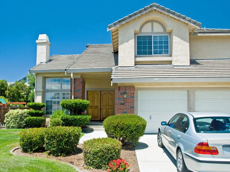 Home with a car parked in the driveway.