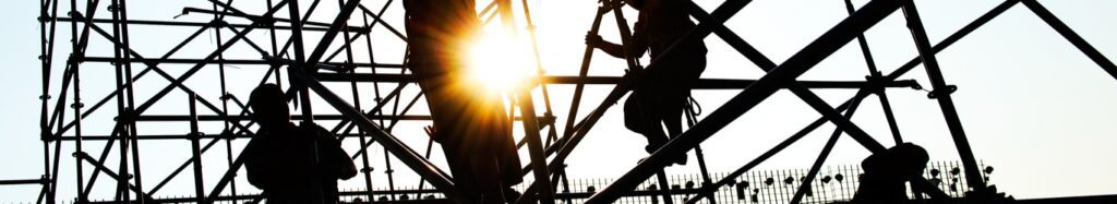 Construction workers working on scaffolding.