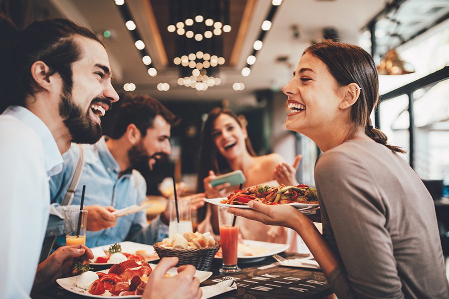 Specialized Business Insurance - Group of Happy Friends Having Breakfast in a Restaurant