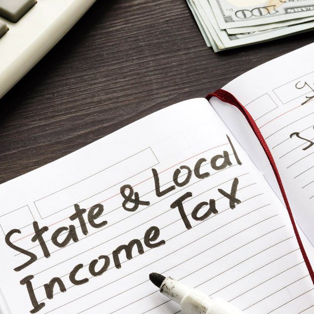 Adobe Stock image of the words State and Local Income Tax in a notebook