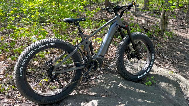 A photo of the Jeep e-bike balanced on a rock. 