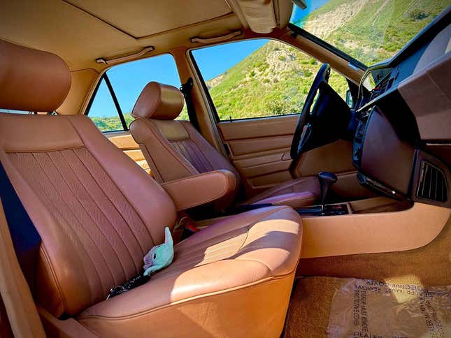 Image for article titled At $10,900, Could This Leather-Upholstered 1985 Mercedes 190E Get You to Have a Cow?