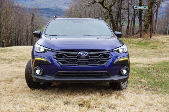 A blue 2024 Subaru Crosstrek Sport.