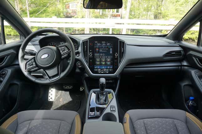 A blue 2024 Subaru Crosstrek Sport.