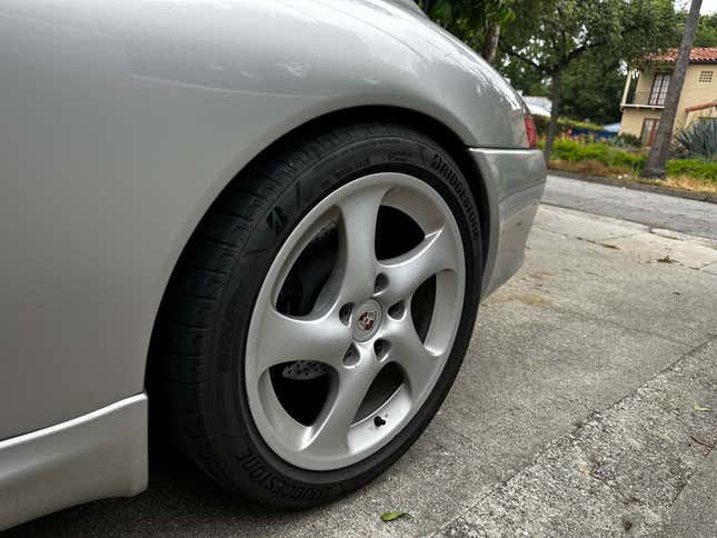 The left rear wheel of a 2003 Porsche 911 Carrera