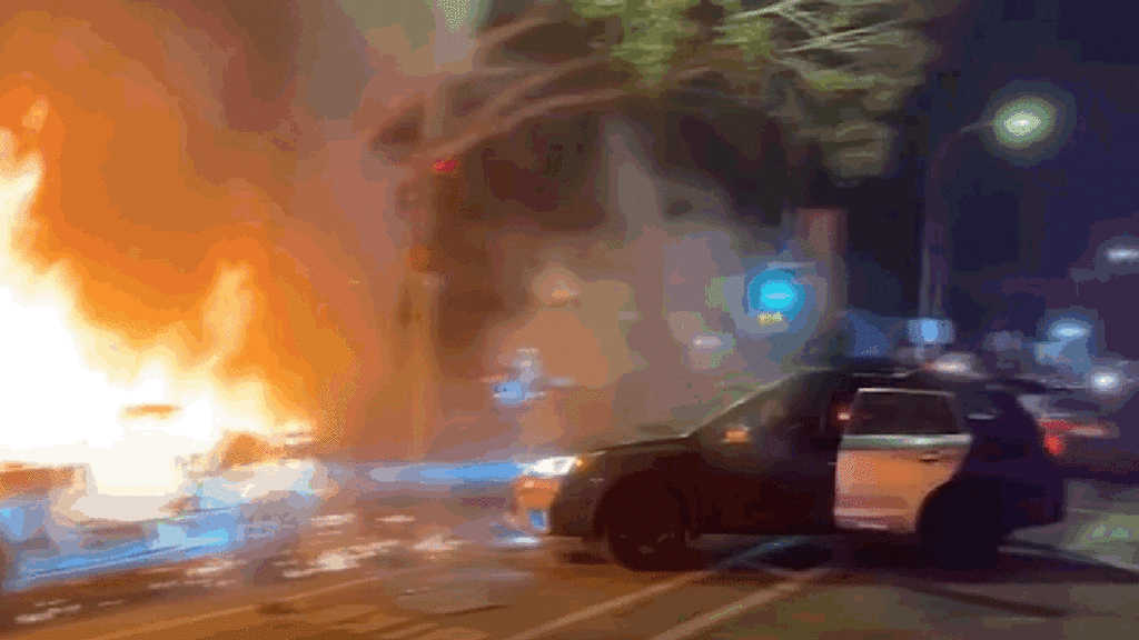 Chaotic Oakland Street Takeover Has Idiot Repeatedly Ram a Burning Nissan Z With a Subaru