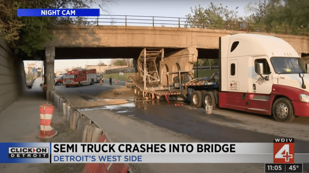 Crane On Semi Hits Low Bridge Hard Enough To Bend Trailer In Half