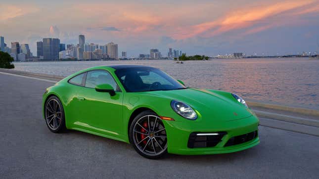 A photo of a green Porsche Carrera 4S