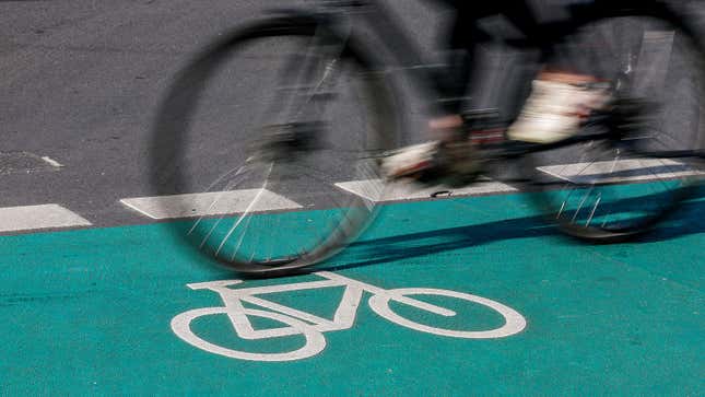 A photo of a bike lane marking on a road. 