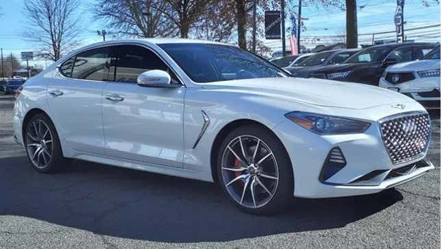 A White Genesis G70 2.0T Sport