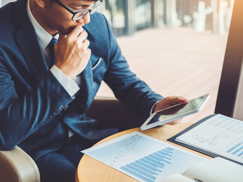 Businessman working and using tablet