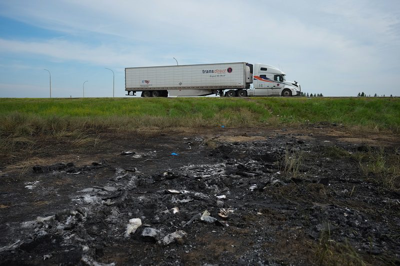 The area where a bus collided with a transport truck