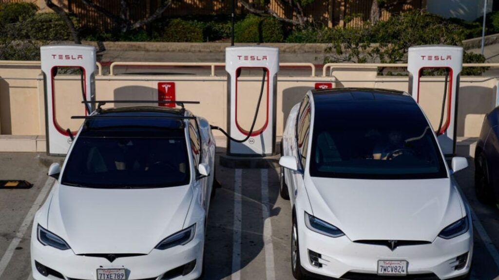 Tesla owners will hate waiting in charging lines behind Ford and GM cars, analyst says