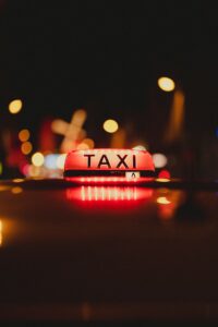 A light on the top of a taxi looking for hire