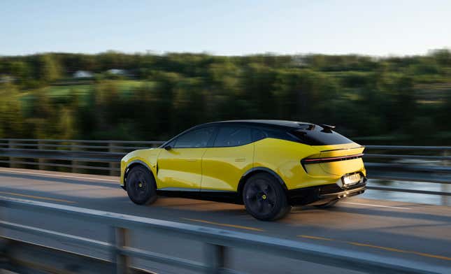 The 2024 Lotus Eletre S in yellow crosses a bridge, side view