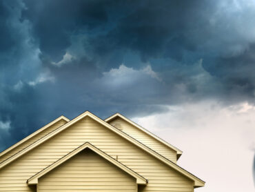 House with tornado in the background