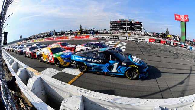 Ross Chastain, driver of the #1 Worldwide Express Chevrolet, leads the field during the NASCAR Cup Series M&M's Fan Appreciation 400 at Pocono Raceway on July 24, 2022 in Long Pond, Pennsylvania.