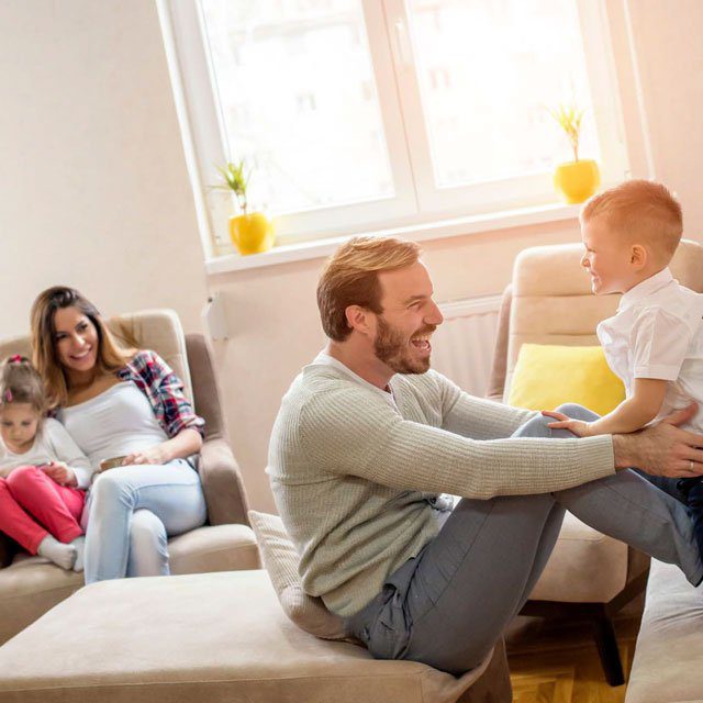 A couple playing with their children