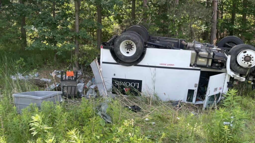 Armored truck rolls, sends money bags flying in Michigan