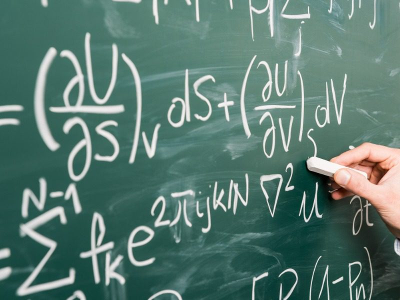 Mathematical equation on a black board