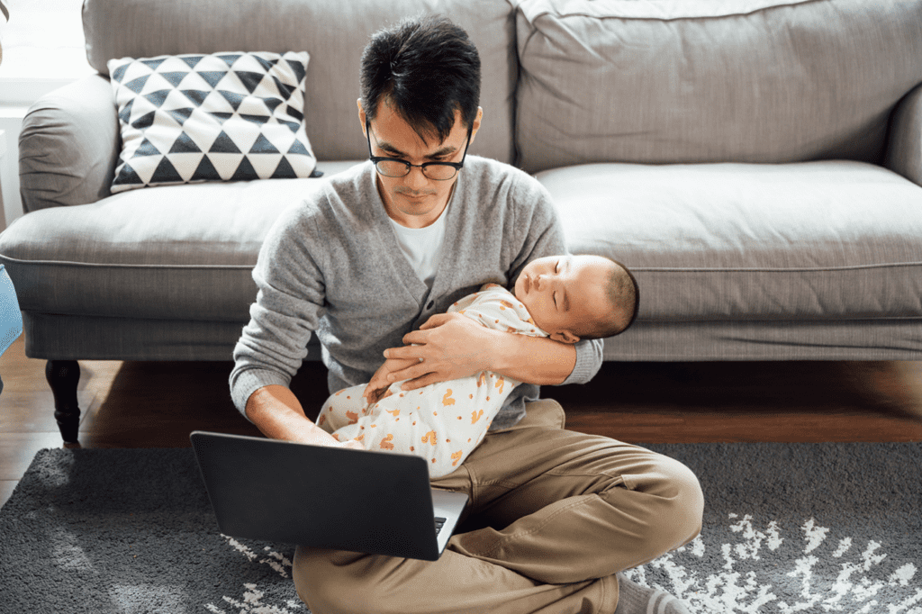 Stock Photo Of Young Family Enjoying Their Time Together And Using Laptop At Kitchen