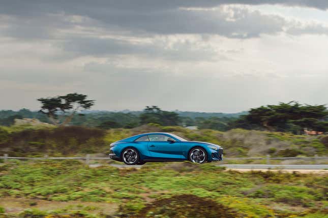 Bentley Batur driving along 17-Mile Drive in Monterey, side view