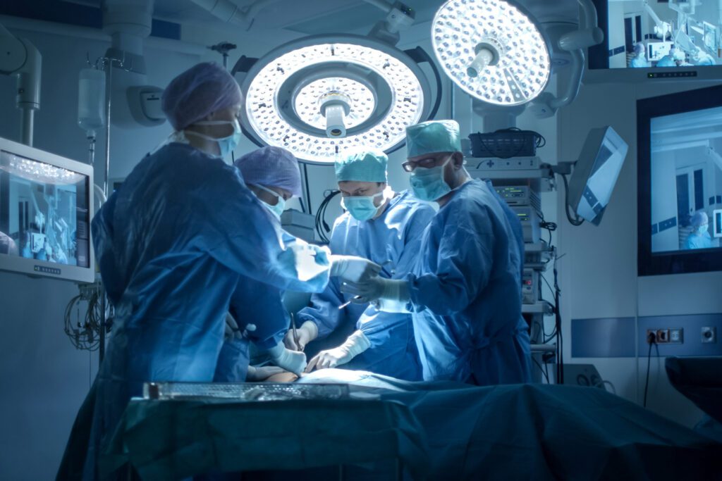 A photo of a medical team ready for surgery in an operating room.